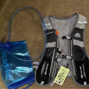 Gray and Black Hydration Vest with Blue Reservoir